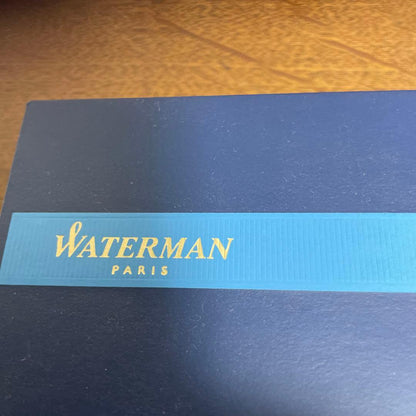 WATERMAN Ballpoint Pen with matte black body and silver trim next to a matching dedicated case