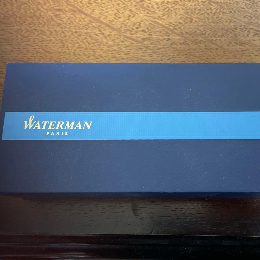 WATERMAN Ballpoint Pen with matte black body and silver trim next to a matching dedicated case
