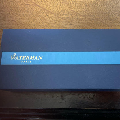 WATERMAN Ballpoint Pen with matte black body and silver trim next to a matching dedicated case