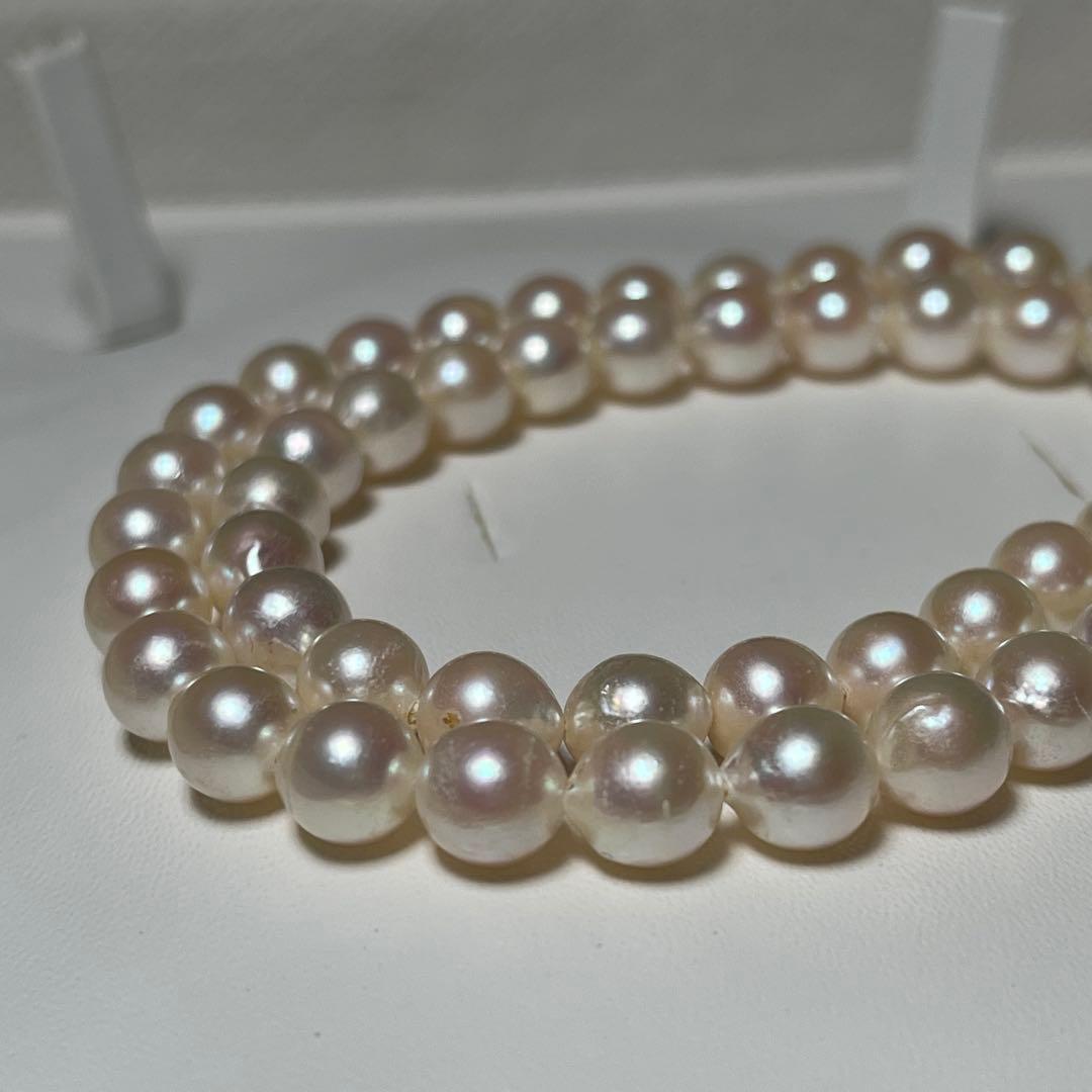 Akoya pearl semi-round necklace measuring 6.9 to 7.3mm with a 43 cm length displayed on a white background