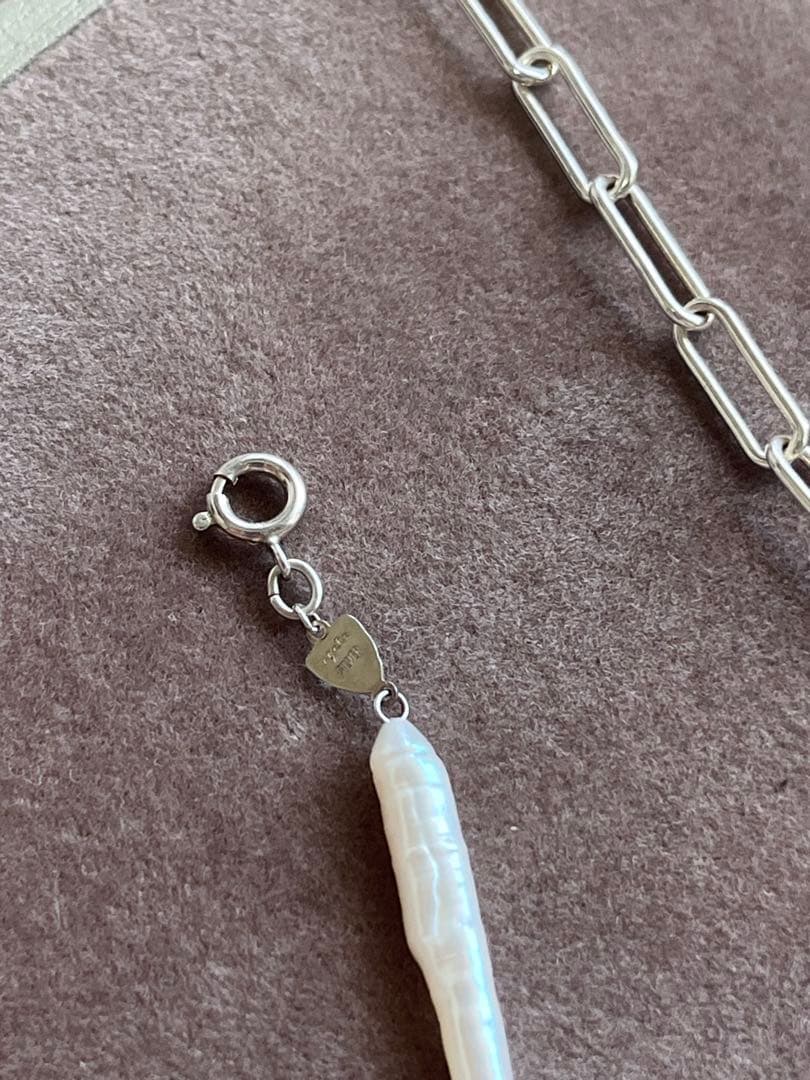 agete Pearl Necklace with round white pearls on a delicate chain