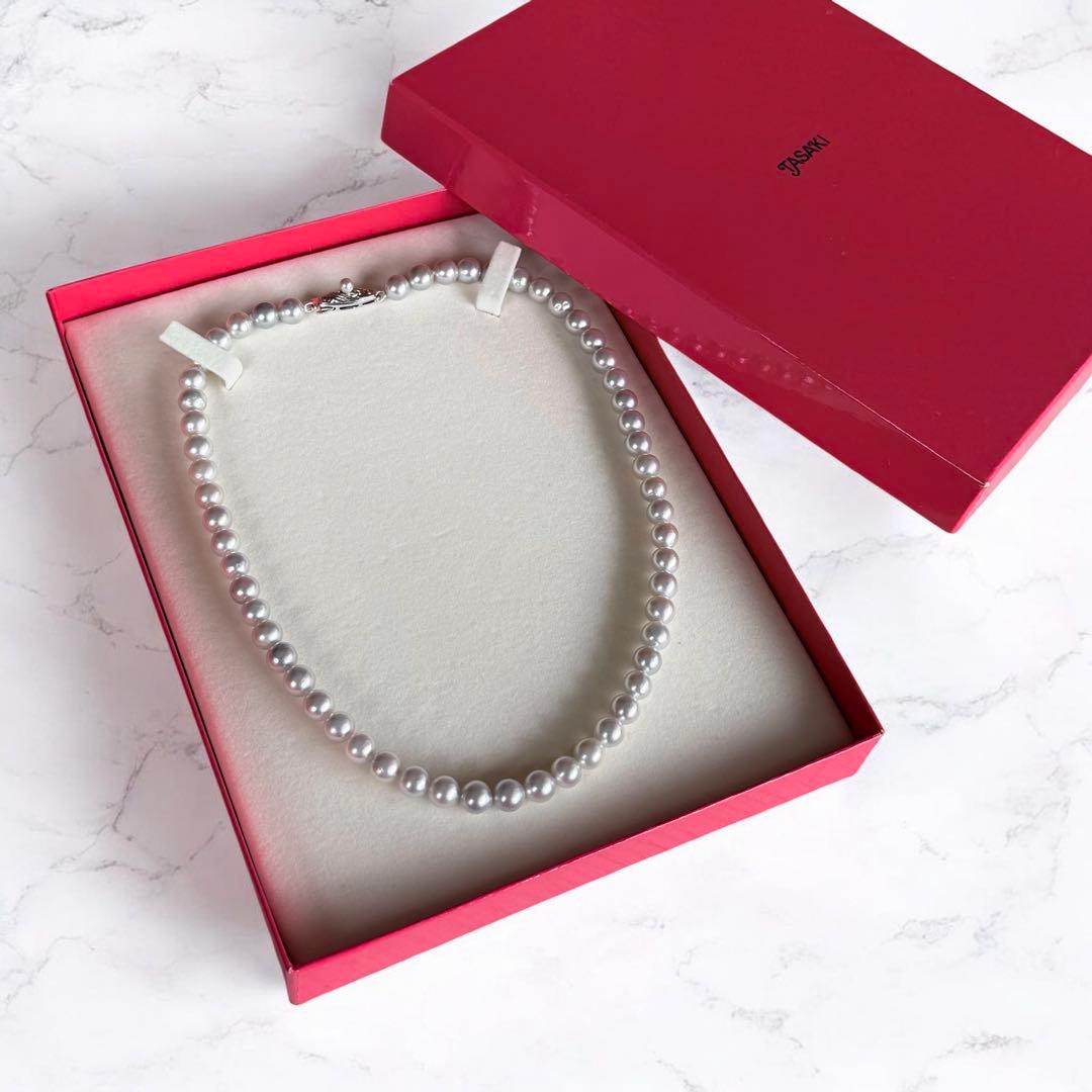 Tossaki Akoya pearl necklace featuring 7-7.5mm round pearls with silver clasp on a 42cm strand