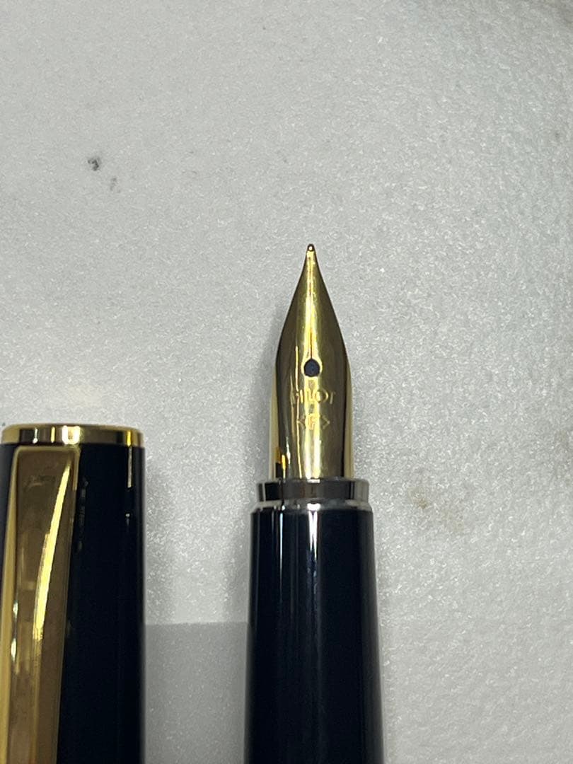 Pilot Japanese-made fountain pen with black and gold barrel and fine gold-plated nib