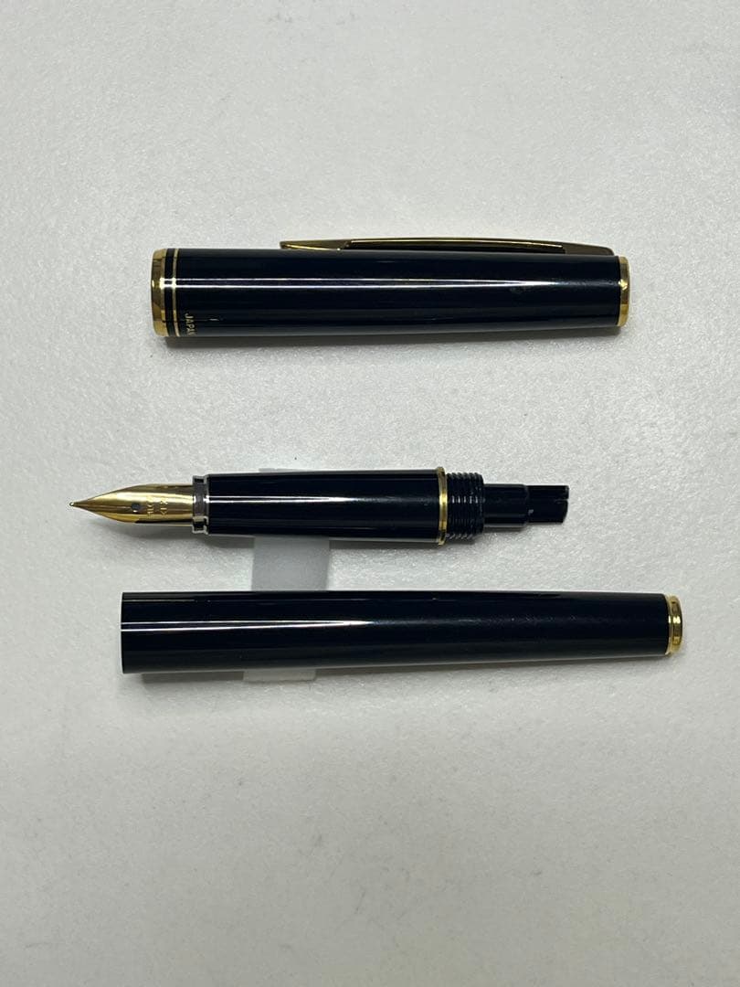 Pilot Japanese-made fountain pen with black and gold barrel and fine gold-plated nib