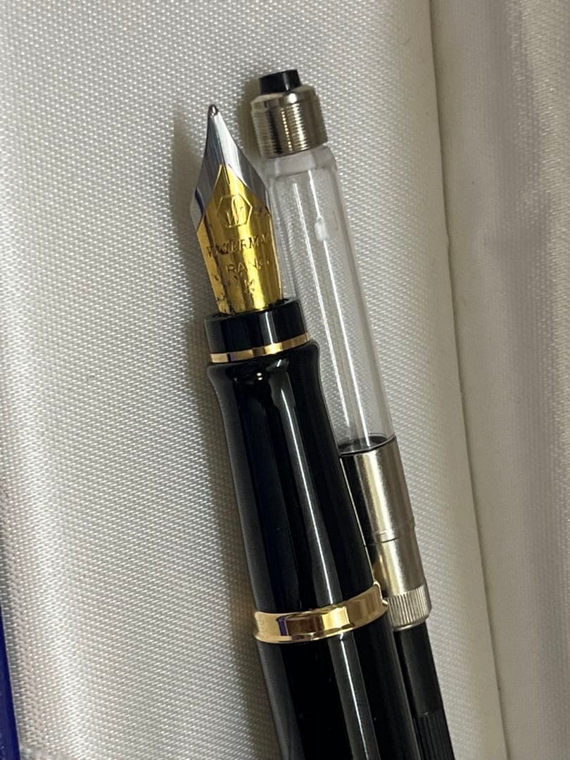 Waterman fountain pen in clean condition with converter included shown on a white background