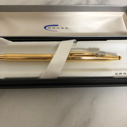 CROSS Ballpoint Pen with sleek silver barrel and black ink tip on white background