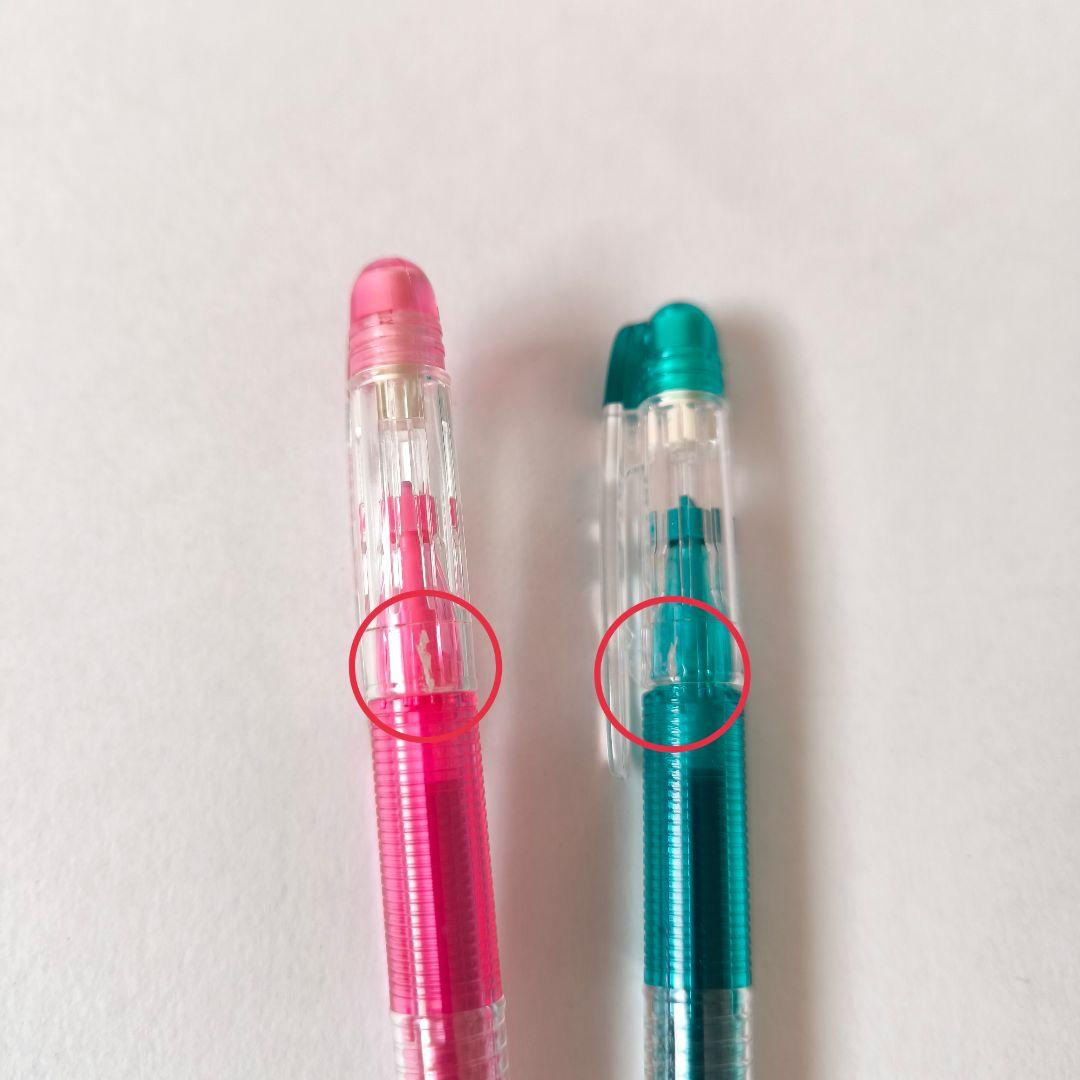 Pilot D-ink pen case set with 12 colorful ballpoint pens and a small mascot figure in a plastic case