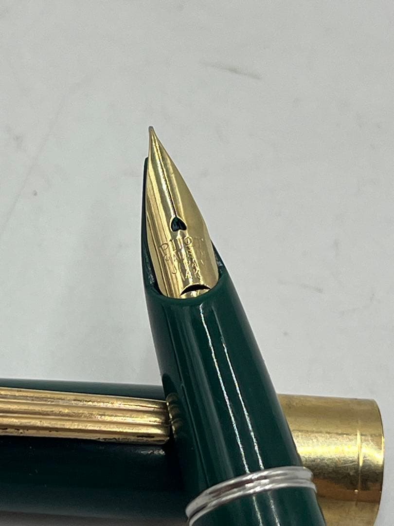 PILOT vintage fountain pen made of 14K green gold displayed on white background