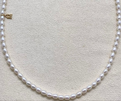Mikimoto baby pearl necklace with removable M charm in K18 yellow gold clasp, pearls about 5mm, length 41cm