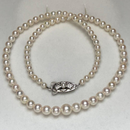 Mikimoto Akoya pearl graduated necklace with 7mm pearls, 40cm length, sterling silver clasp