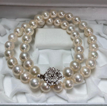 Akoya pearl necklace with pinkish white 9-9.5mm pearls and silver fittings displayed on white background