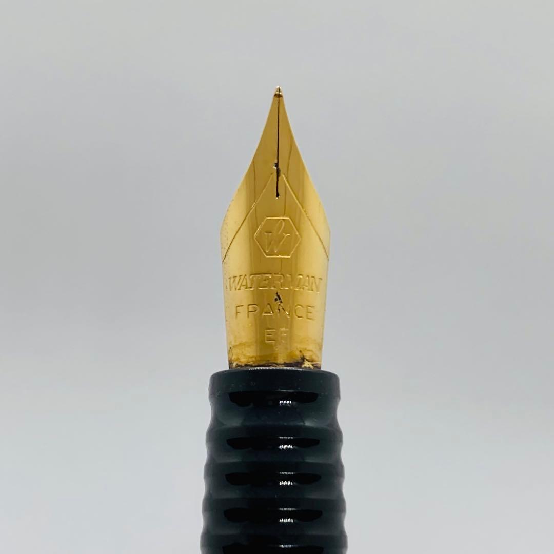 Waterman Lorea Red Marble fountain pen with extra fine nib, shown uncapped on white background