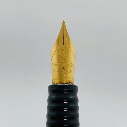 Waterman Lorea Red Marble fountain pen with extra fine nib, shown uncapped on white background