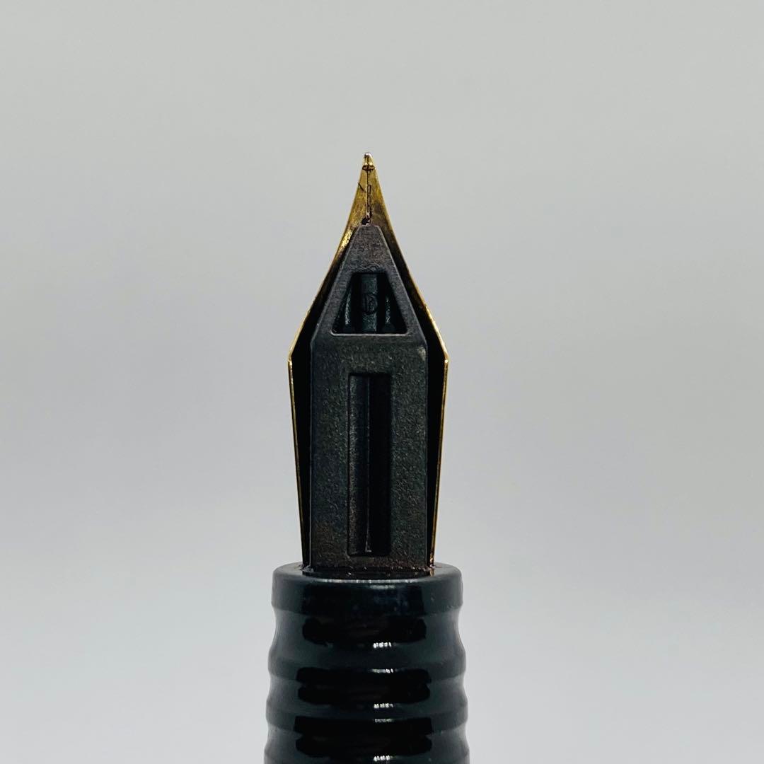 Waterman Lorea Red Marble fountain pen with extra fine nib, shown uncapped on white background