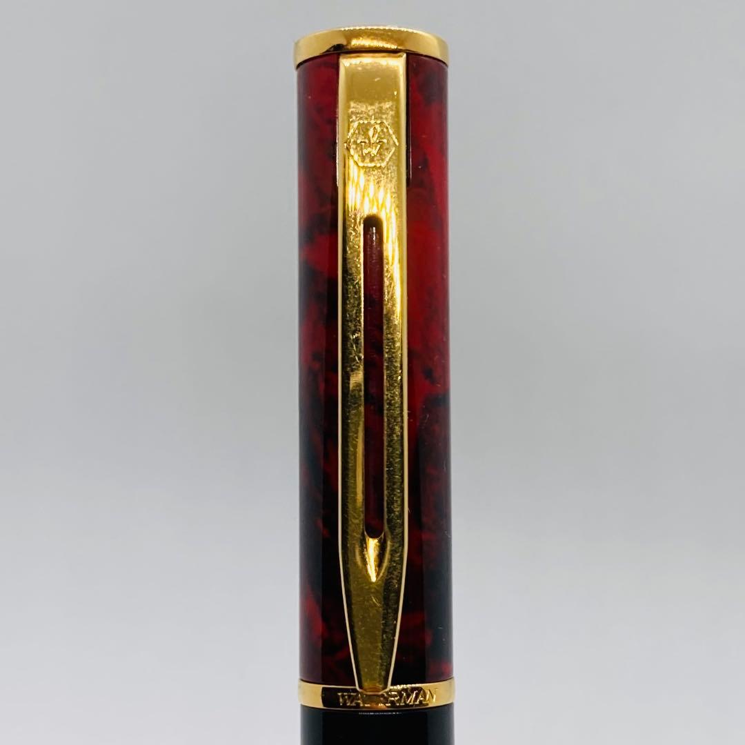 Waterman Lorea Red Marble fountain pen with extra fine nib, shown uncapped on white background