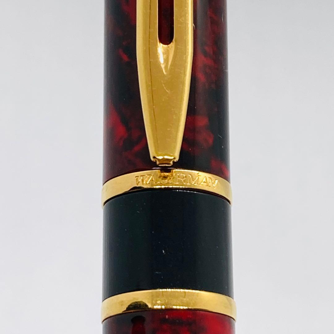 Waterman Lorea Red Marble fountain pen with extra fine nib, shown uncapped on white background