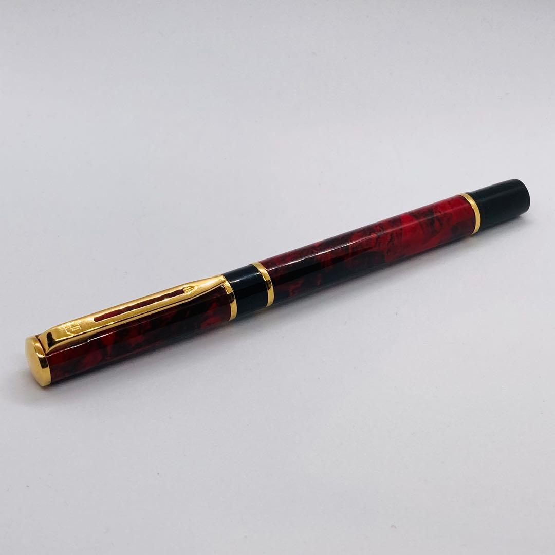 Waterman Lorea Red Marble fountain pen with extra fine nib, shown uncapped on white background