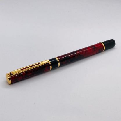 Waterman Lorea Red Marble fountain pen with extra fine nib, shown uncapped on white background