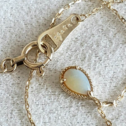Opal droplet necklace with K10 gold and agate pendant on a delicate gold chain