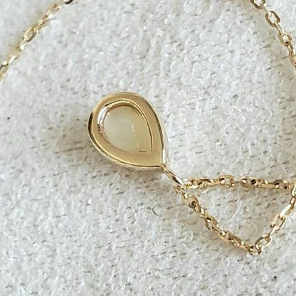 Opal droplet necklace with K10 gold and agate pendant on a delicate gold chain