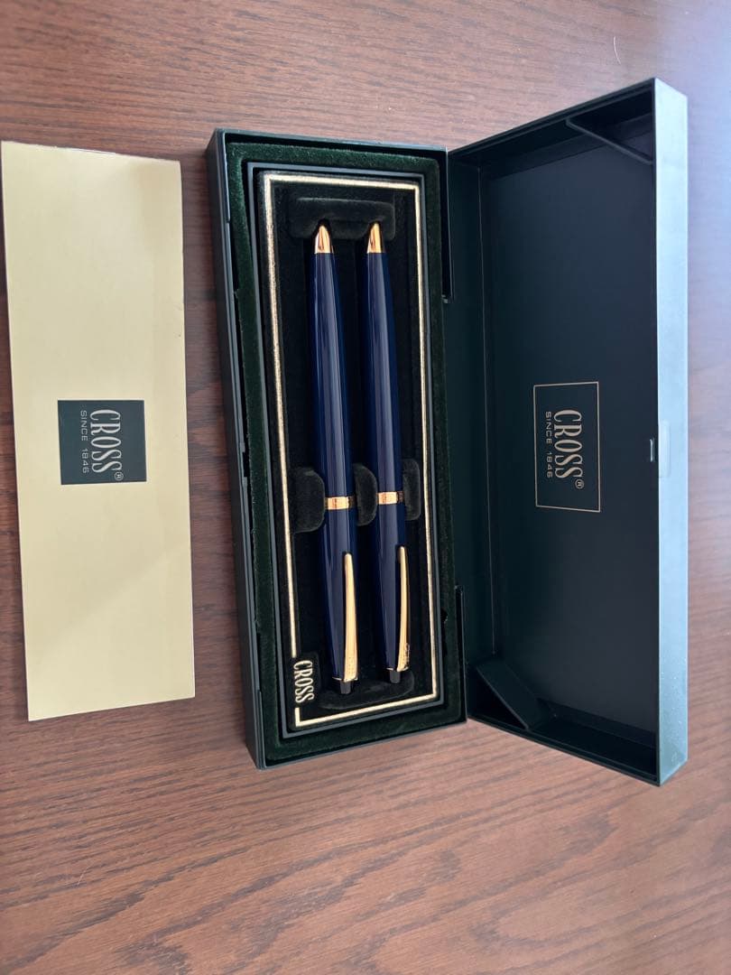 CROSS ballpoint pen and mechanical pencil set in navy and gold with a dedicated case showing slight cushion damage