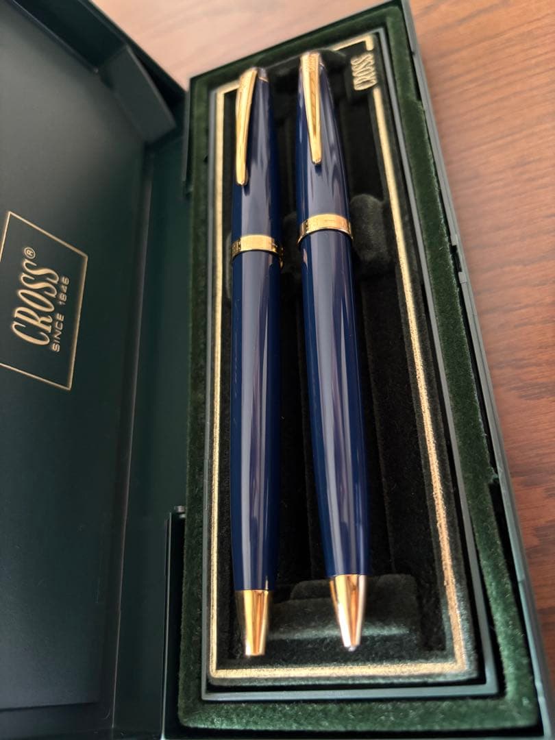 CROSS ballpoint pen and mechanical pencil set in navy and gold with a dedicated case showing slight cushion damage