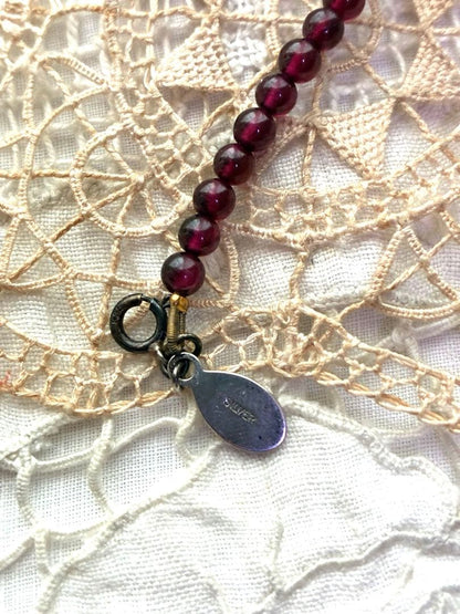 Agete garnet necklace with silver 925 chain and round pendant featuring a 1 cm garnet stone