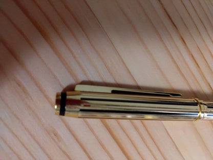 Used CROSS Selectip rolling ball pen in 22K gold with black lacquer finish and visible dent on pen body