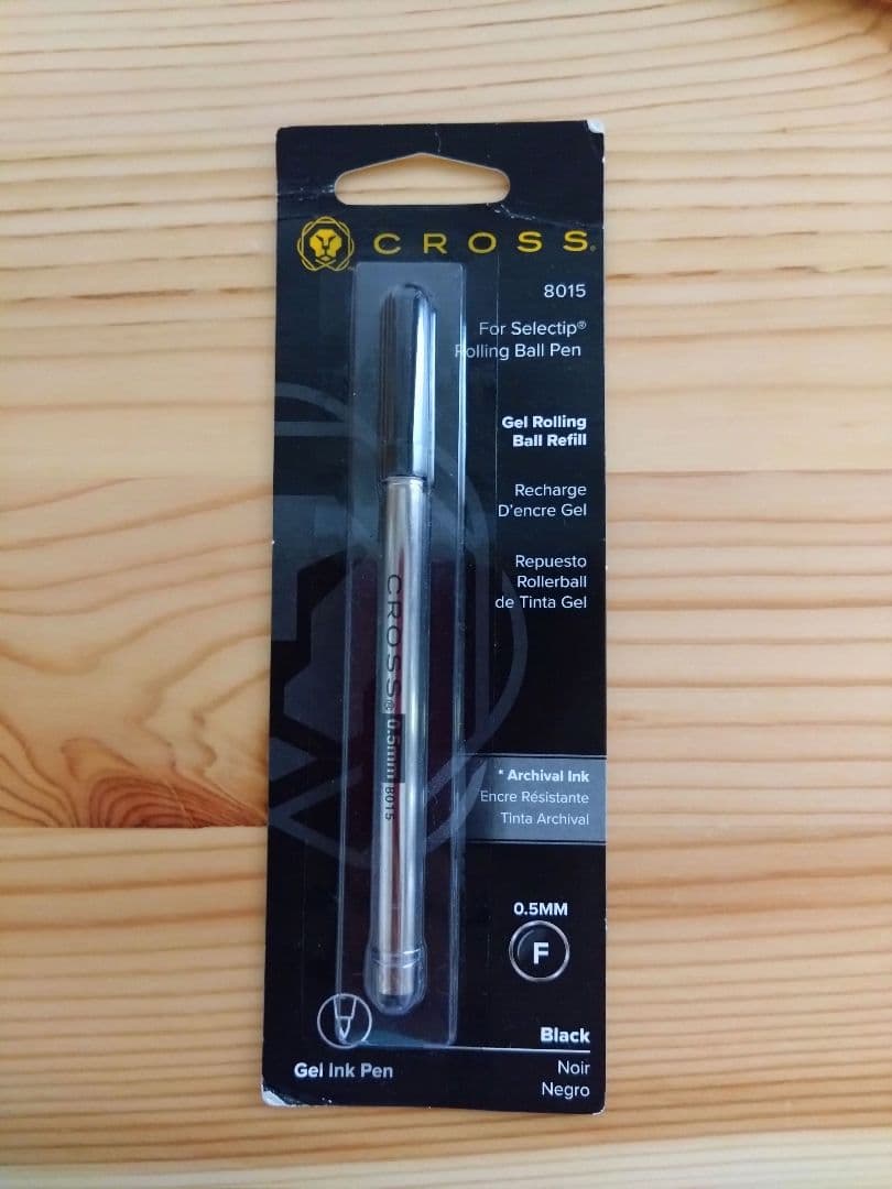 Used CROSS Selectip rolling ball pen in 22K gold with black lacquer finish and visible dent on pen body