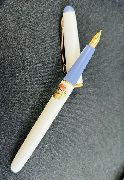 Pilot Fountain Pen Fineline in off-white with gold trim and purple accents on cap and barrel