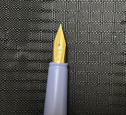 Pilot Fountain Pen Fineline in off-white with gold trim and purple accents on cap and barrel