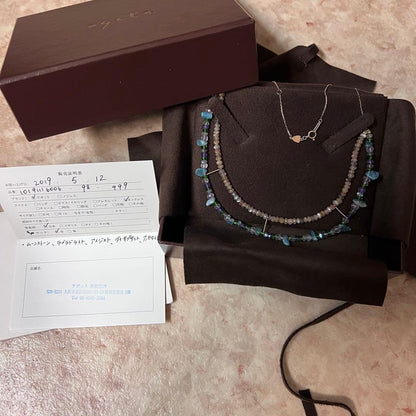 Gabatt K10 stone necklace with moonstone, labradorite, amethyst, dissit, and apatite on a white background