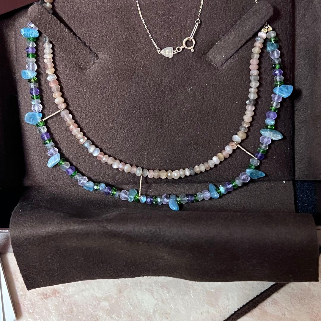 Gabatt K10 stone necklace with moonstone, labradorite, amethyst, dissit, and apatite on a white background