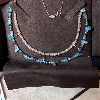 Gabatt K10 stone necklace with moonstone, labradorite, amethyst, dissit, and apatite on a white background