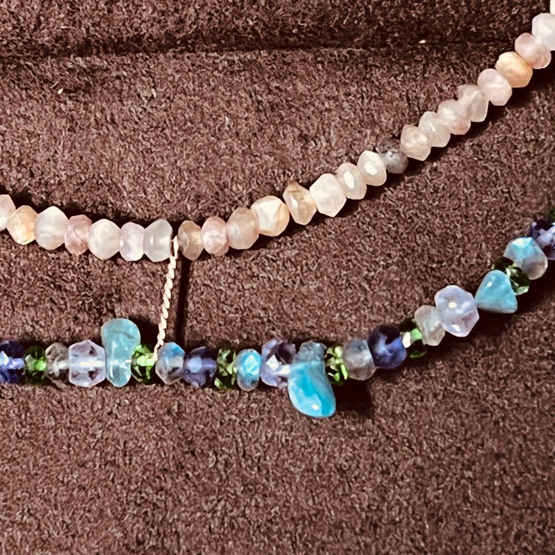 Gabatt K10 stone necklace with moonstone, labradorite, amethyst, dissit, and apatite on a white background