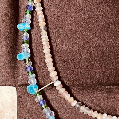 Gabatt K10 stone necklace with moonstone, labradorite, amethyst, dissit, and apatite on a white background