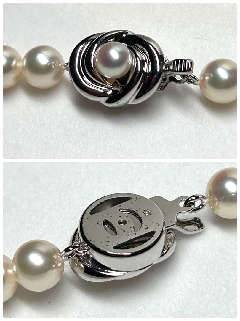 Tasaki Akoya pearl necklace with 7.5mm pearls and silver metal fittings laid flat