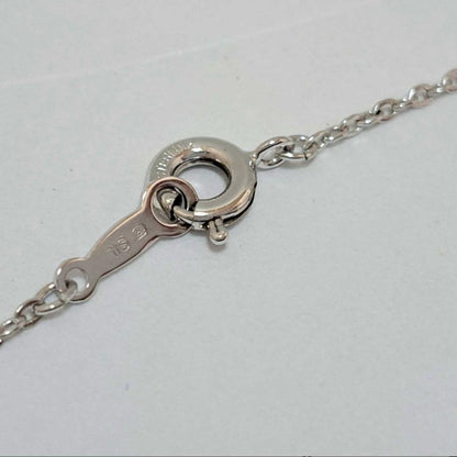 Mikimoto Akoya Pearl silver necklace featuring a 6mm pearl on a delicate chain with engraved silver motif