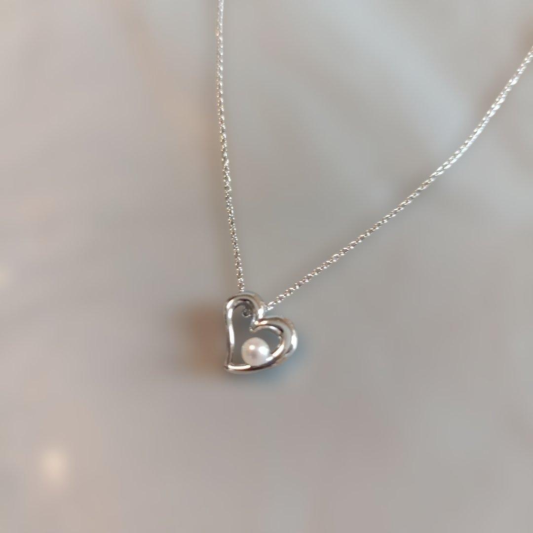 Tasaki Pearl Heart Necklace with heart motif and pearl decoration shown with dedicated case