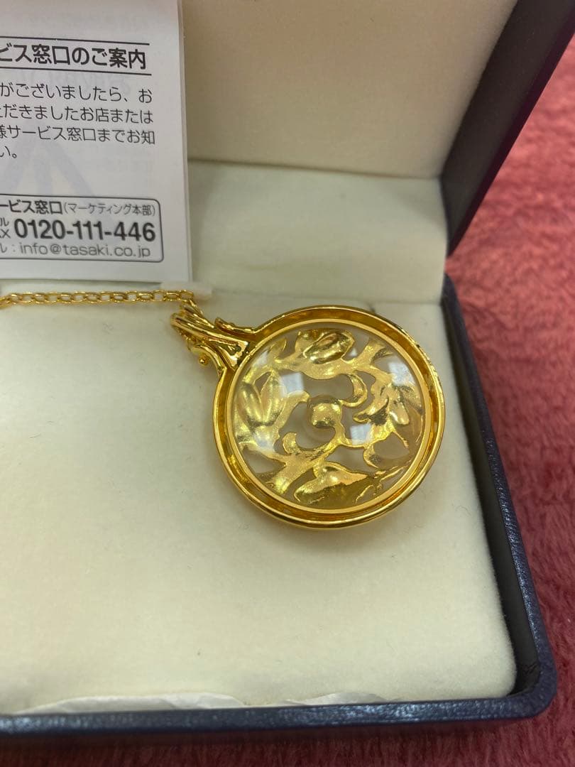Tasaki Baby Pearl Loupe Necklace with gold color and genuine pearls displayed on a white background