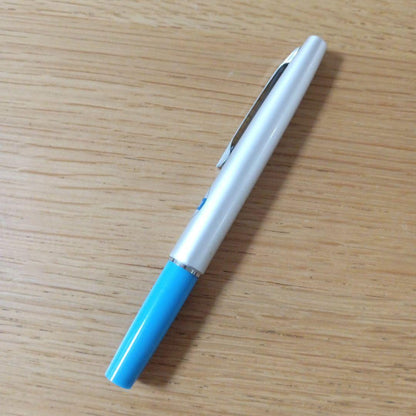 Discontinued Pilot short ballpoint pen in blue and silver with minor storage scratches
