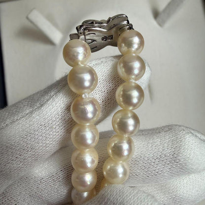 Tasaki Akoya pearl necklace with 6.5-7mm pearls and ribbon clasp displayed with jewelry box