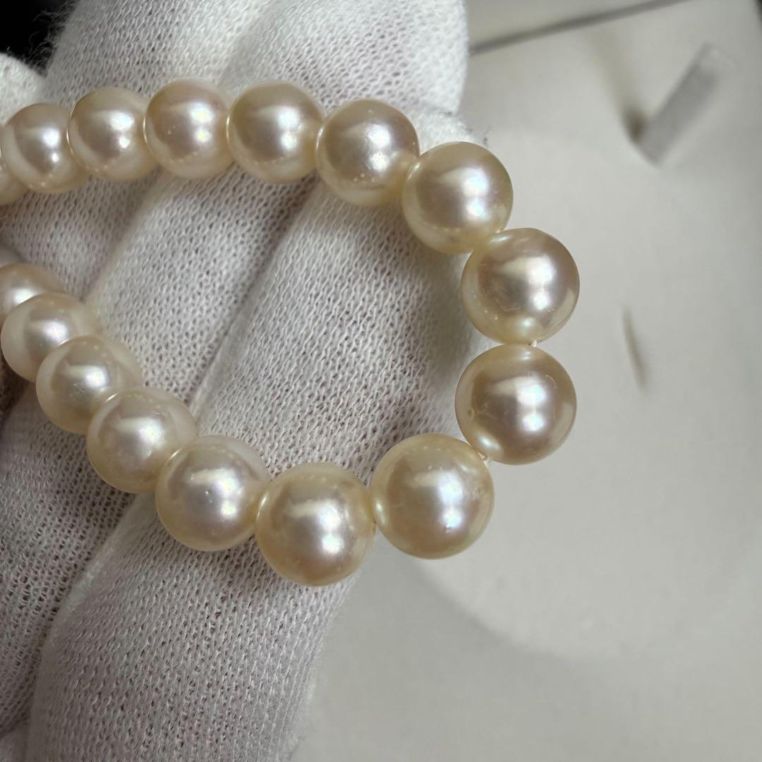 Tasaki Akoya pearl necklace with 6.5-7mm pearls and ribbon clasp displayed with jewelry box