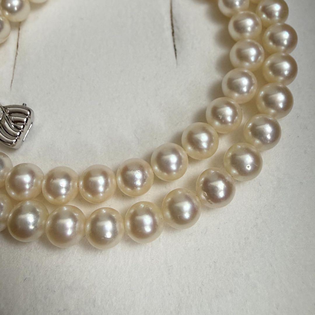 Tasaki Akoya pearl necklace with 6.5-7mm pearls and ribbon clasp displayed with jewelry box