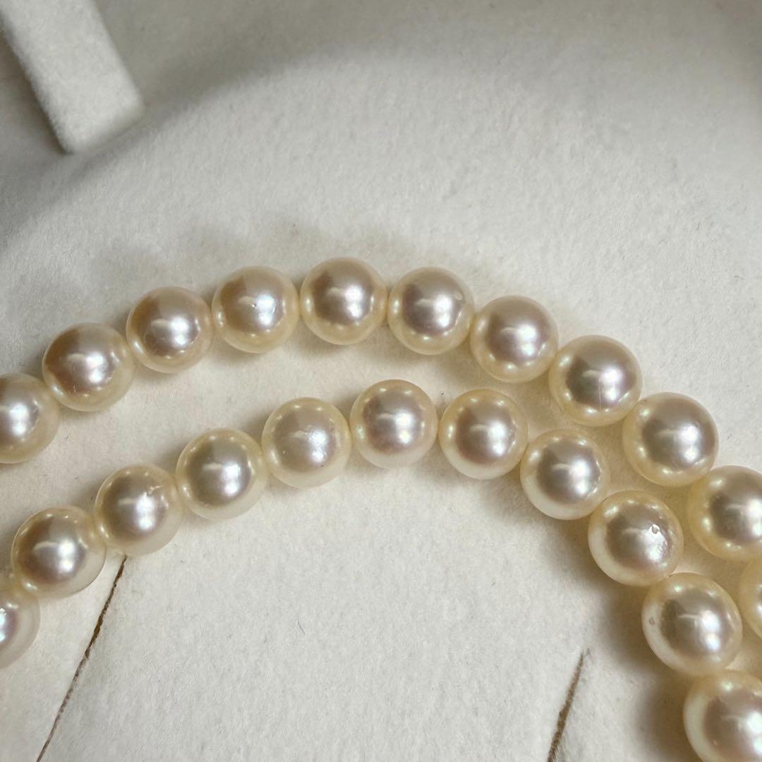 Tasaki Akoya pearl necklace with 6.5-7mm pearls and ribbon clasp displayed with jewelry box