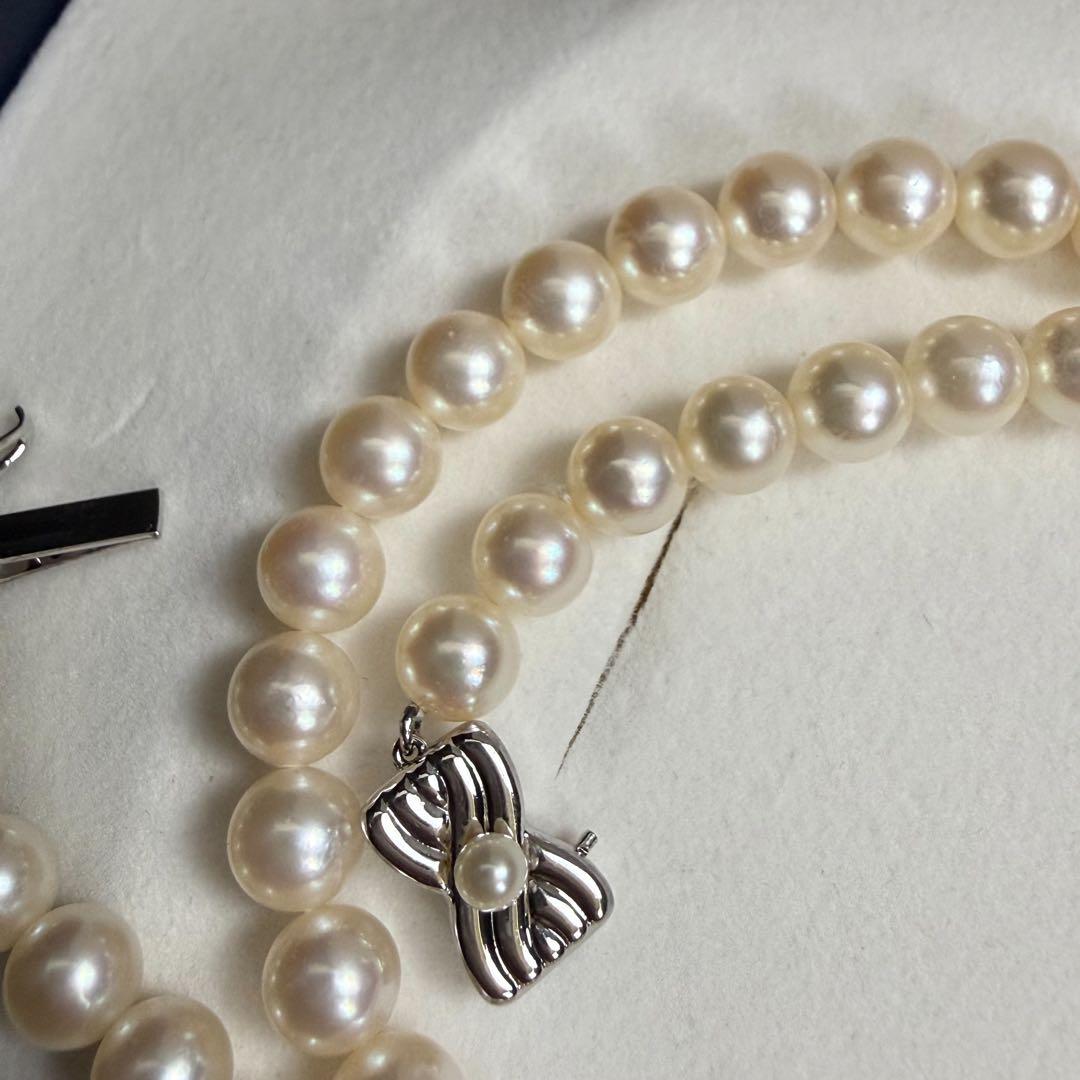 Tasaki Akoya pearl necklace with 6.5-7mm pearls and ribbon clasp displayed with jewelry box