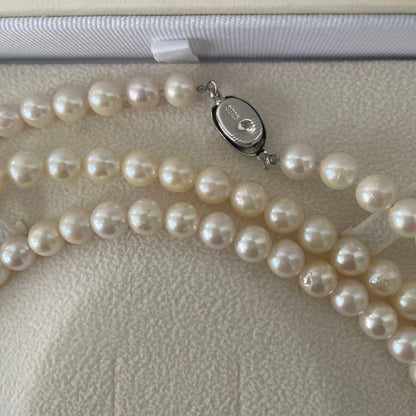 Akoya pearl necklace with 6.5-7mm round pearls, 142cm length, silver push type clasp, displayed with box