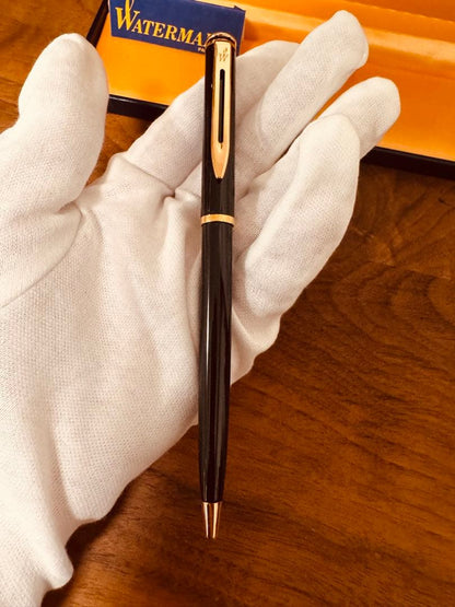 Waterman black ballpoint pen main body with tip extended against white background