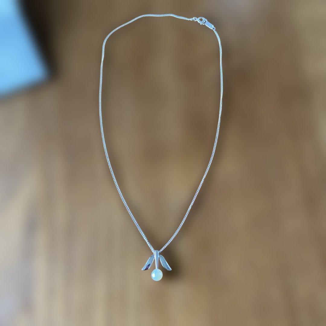 MIKIMOTO Silver Pearl Necklace featuring lustrous pearls on a delicate silver chain