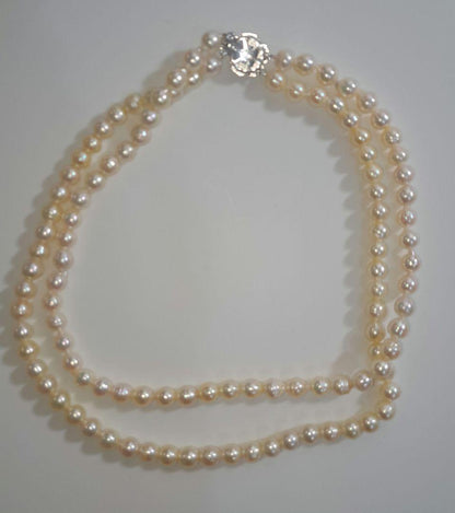 Double strand Akoya pearl necklace with 6mm white pearls and decorative clasp